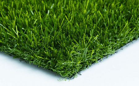Close-up of artificial green grass turf with dense blades.