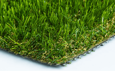 A close-up of artificial grass turf with a textured backing.
