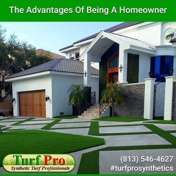 Modern home with a garage and landscaped front yard, highlighting homeownership benefits.